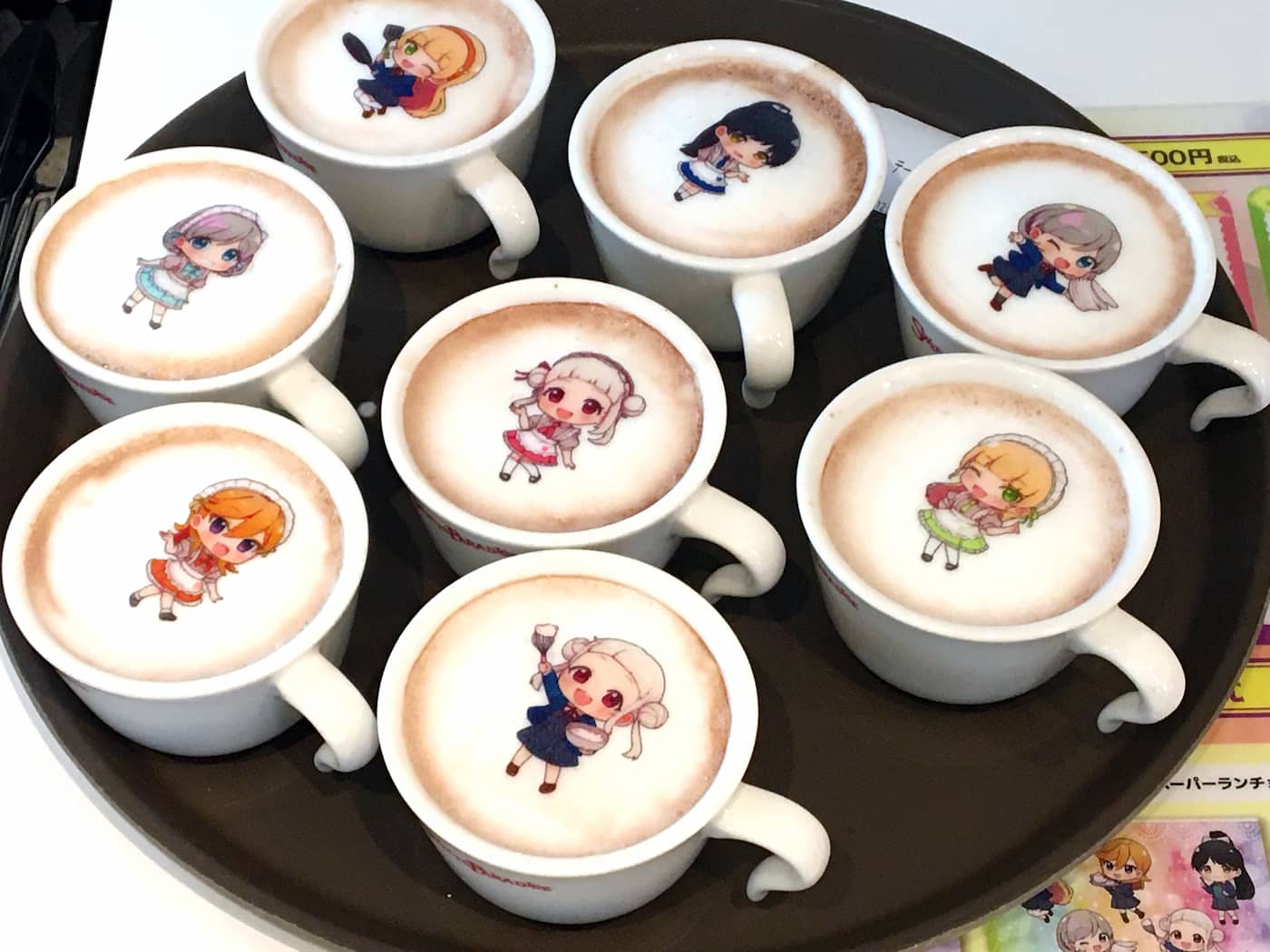 A selection of lattes featuring latte art of characters from the anime show Love Live! Superstar!!