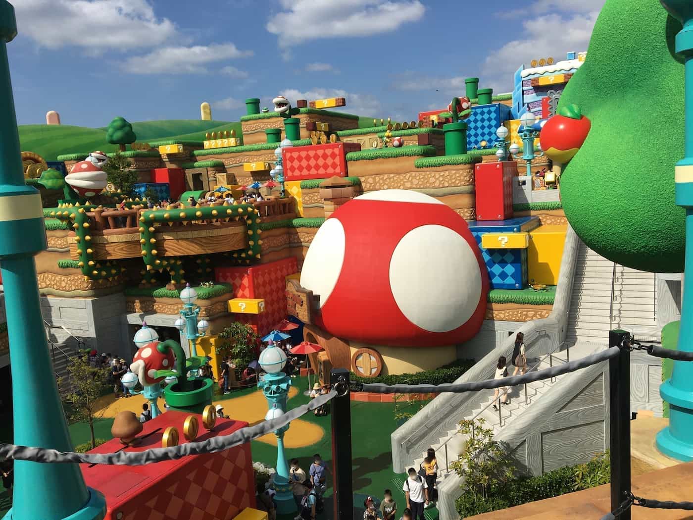 View from the top level overlooking Super Nintendo World, highlighting various attractions.