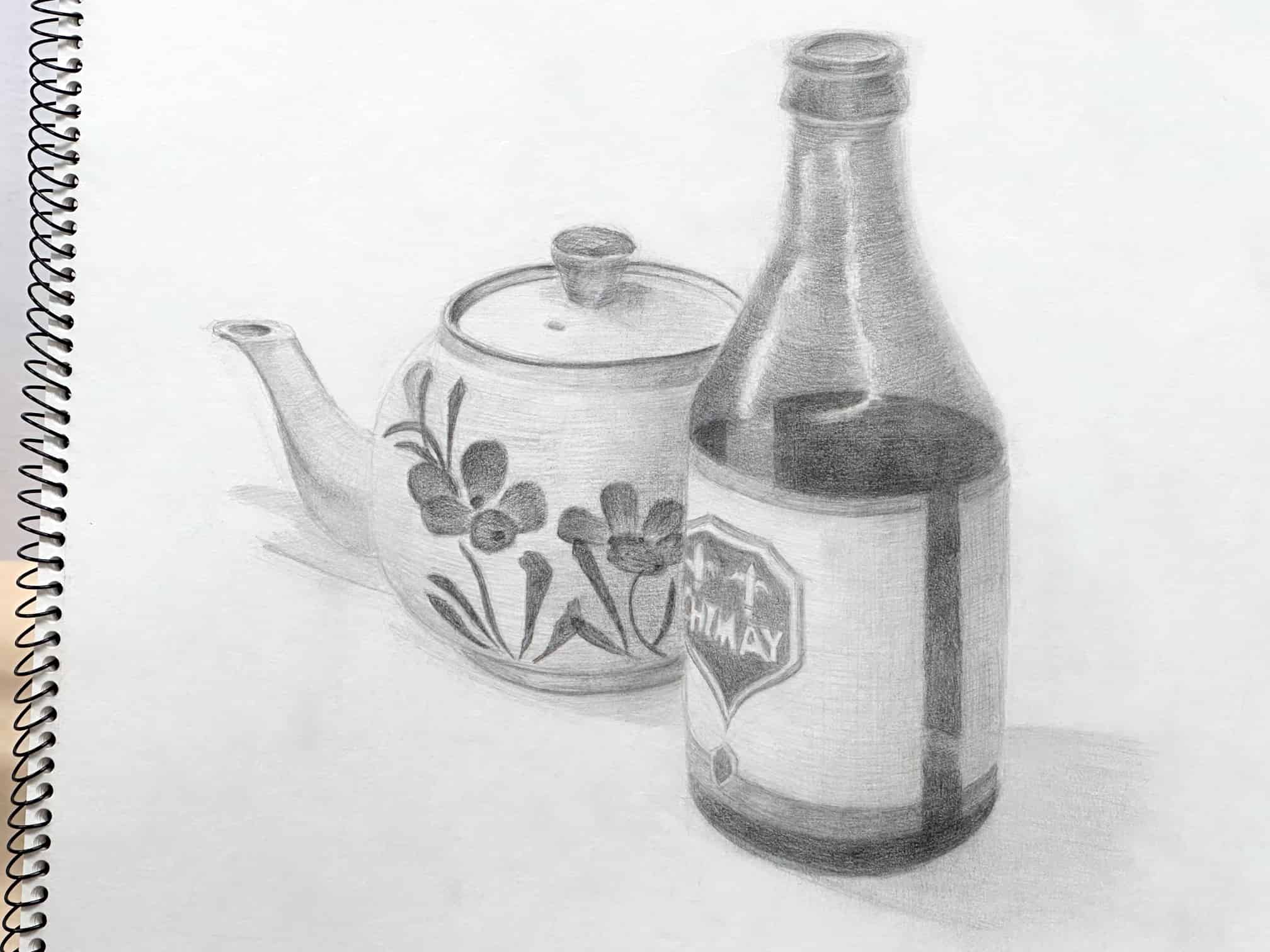 Atmospheric black and white pencil sketch depicts a rustic teapot and a glass bottle – In progress work, final drawing of 2023