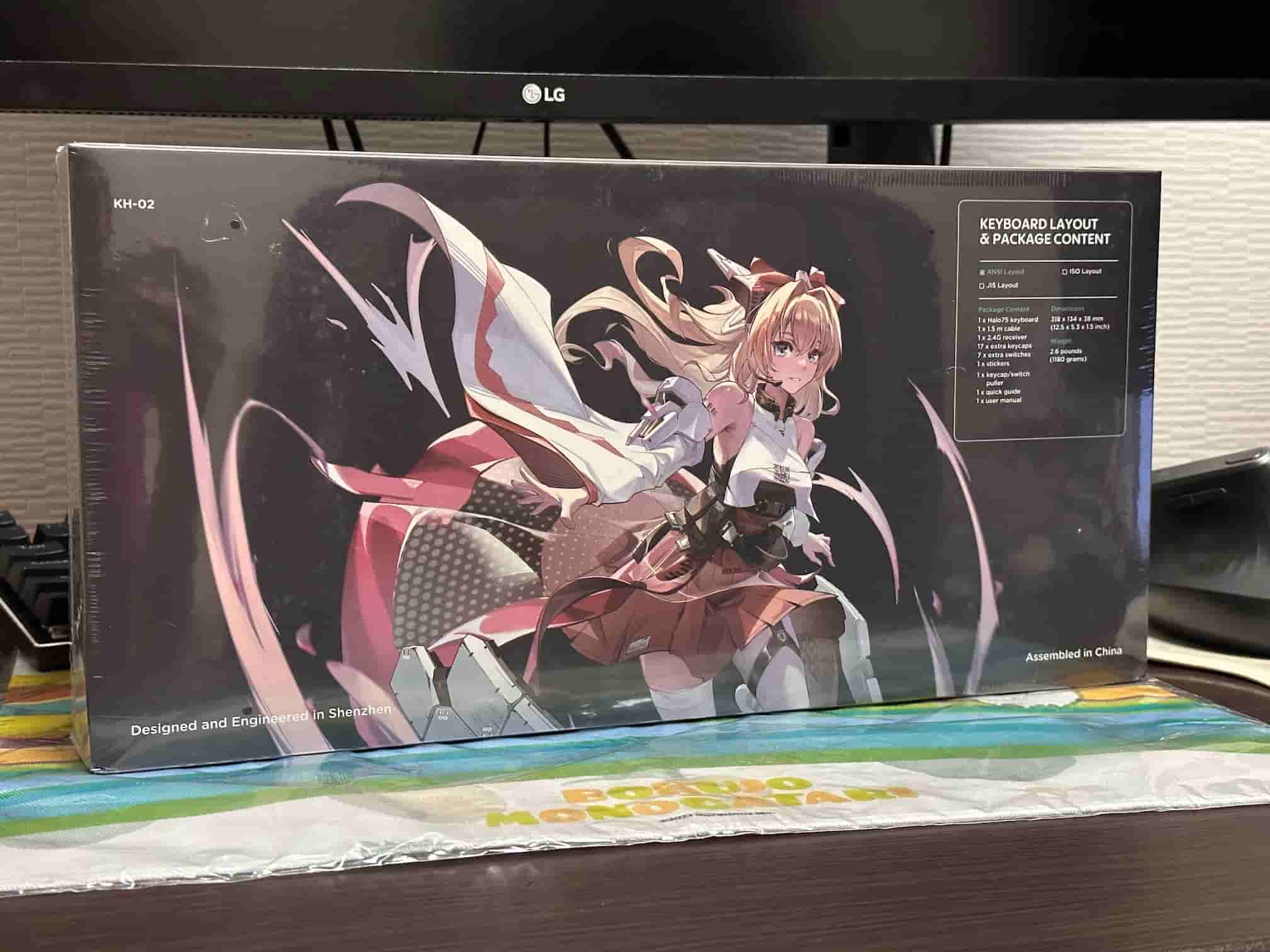 Boxed NuPhy Halo75 mechanical keyboard featuring a prominent anime girl illustration on the back. The box also includes details on the keyboard layout and package contents, noting the design and engineering in Shenzhen and assembly in China