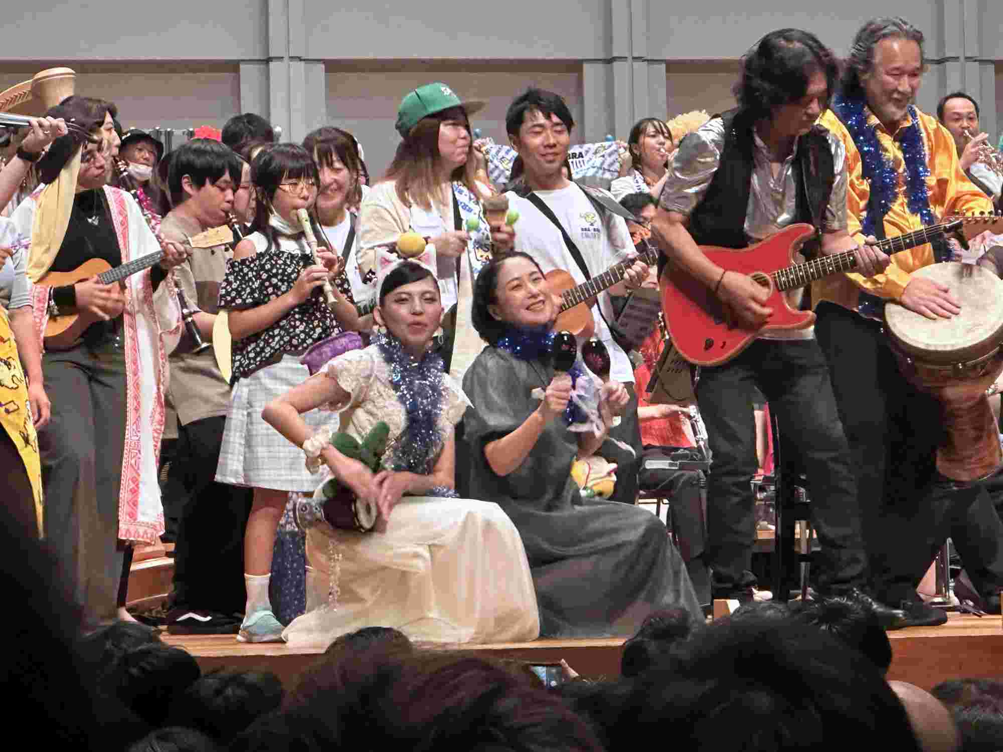 Musicians and audience members on stage during the BRA★BRA FINAL FANTASY 2024 concert encore, playing various instruments and celebrating together