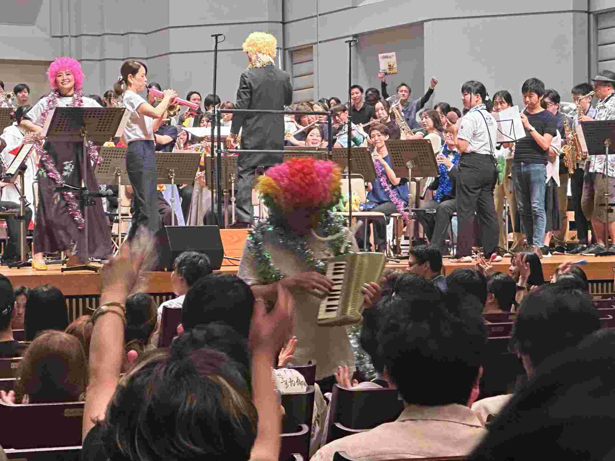 Nobuo Uematsu playing a melodica and interacting with the audience during the BRA★BRA FINAL FANTASY 2024 concert encore